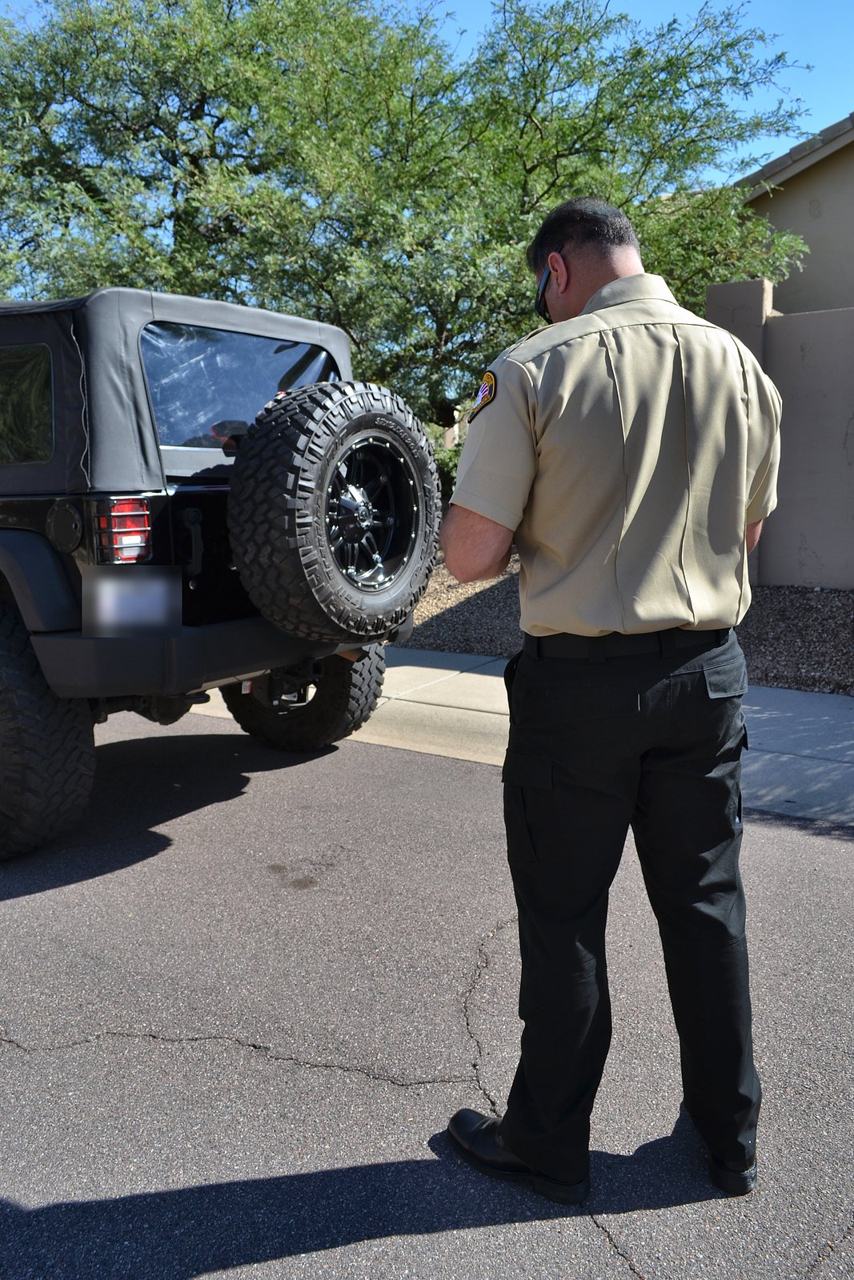 SecureOne security officer checking a parked vehicle